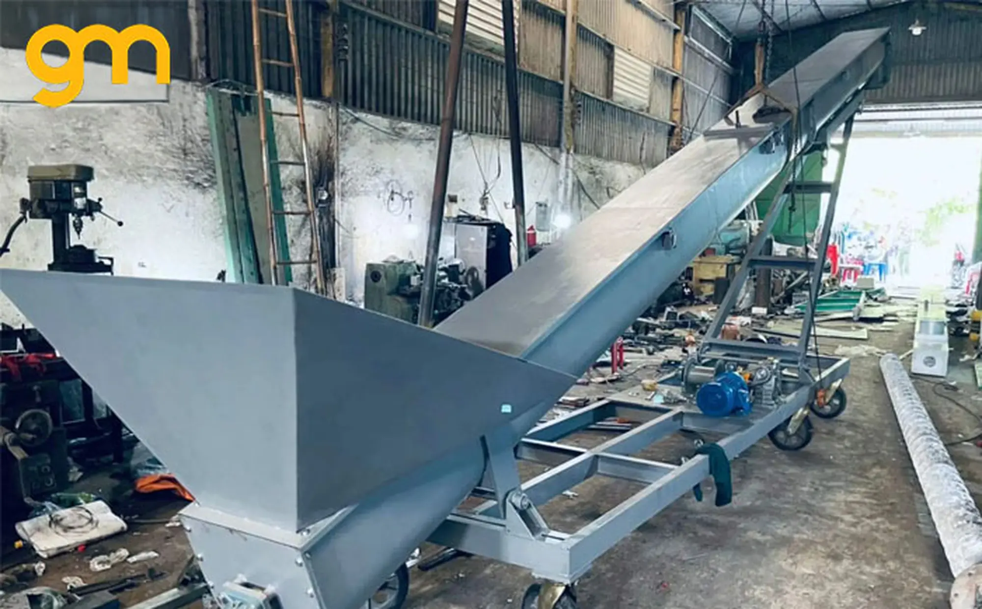 Nguyên lí hoạt động băng tải trục vít